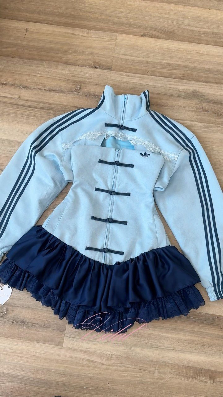 Light blue Adidas Chinese style dress with dark blue ruffled skirt on wood floor