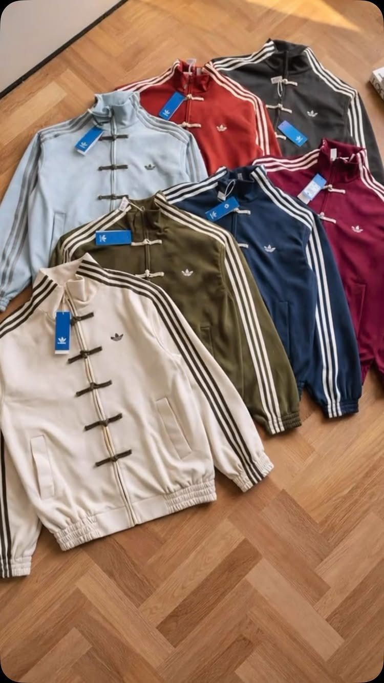 Adidas track jackets in multiple colors with traditional Chinese frog button closures.