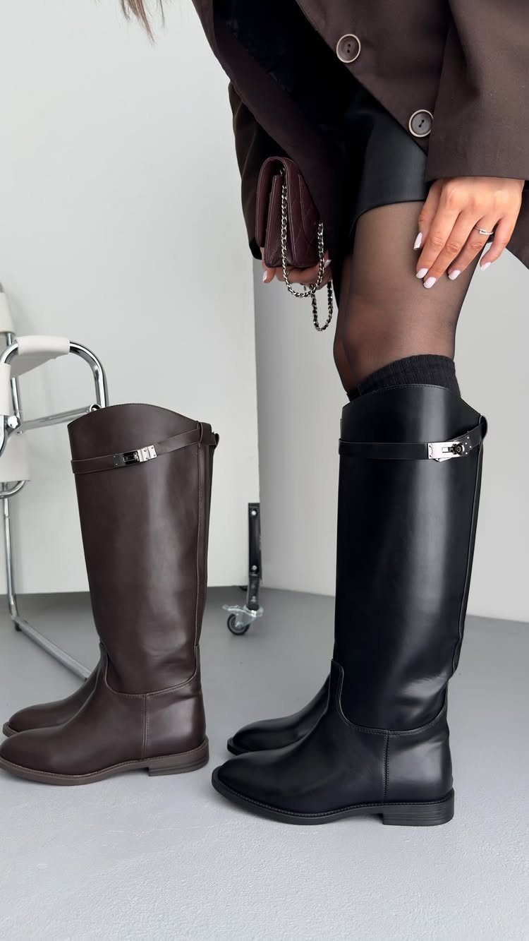 Black and dark brown knee-high leather boots compared side by side on a person.