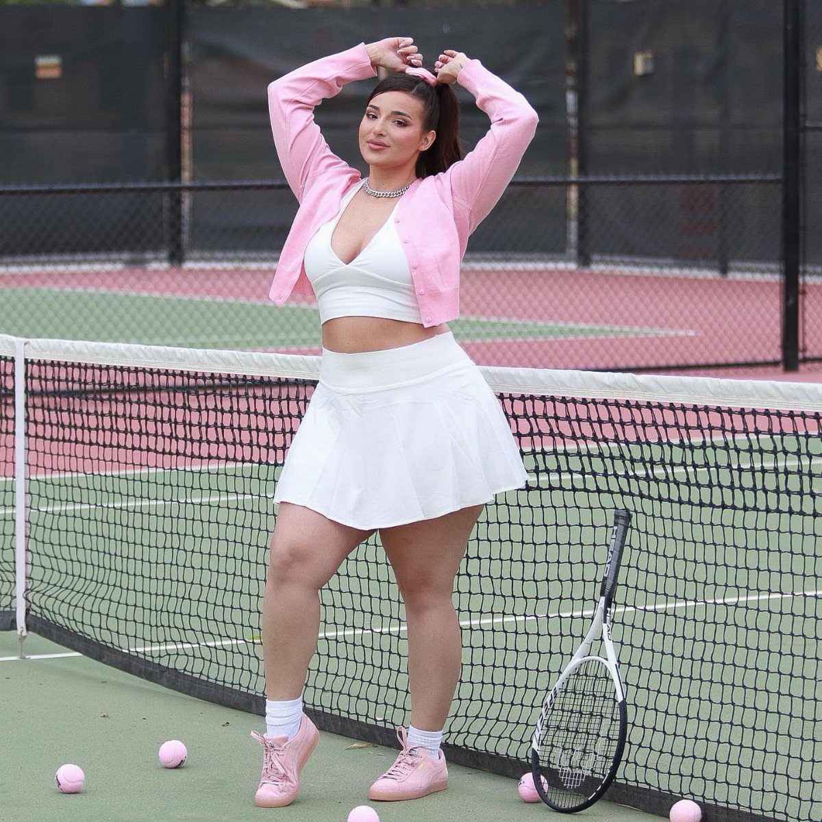 Clothing and Shoes: 8 Ideas for Everyday Outfits 8 Woman in pink blazer and white tennis outfit posing on a tennis court