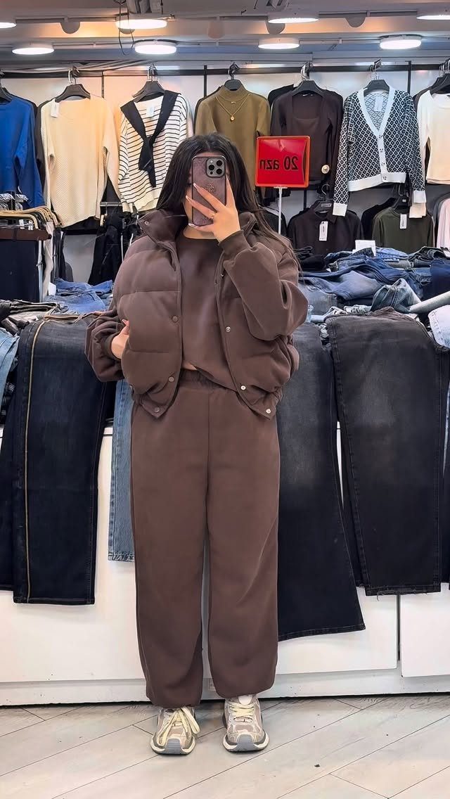 Clothing and Shoes: 8 Ideas for Everyday Outfits 5 Person wearing a brown puffer jacket and matching trousers with beige sneakers in store