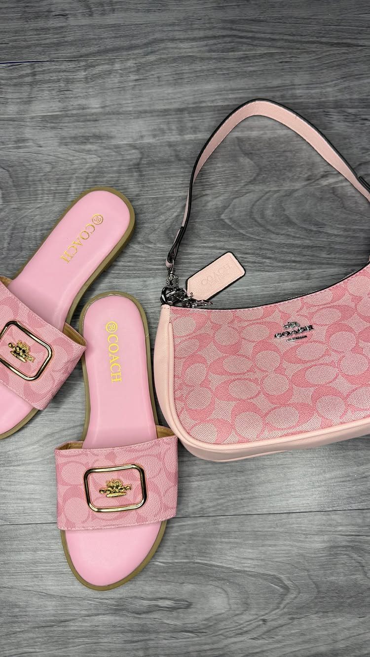 Pink Coach Brynn sandals and matching signature logo handbag on grey wood background