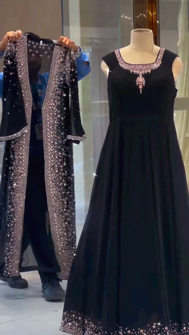 9 Dress and Coat Outfit Ideas for Work, Evenings and More 7 Black floor-length gown and matching sequined open coat displayed on a mannequin.