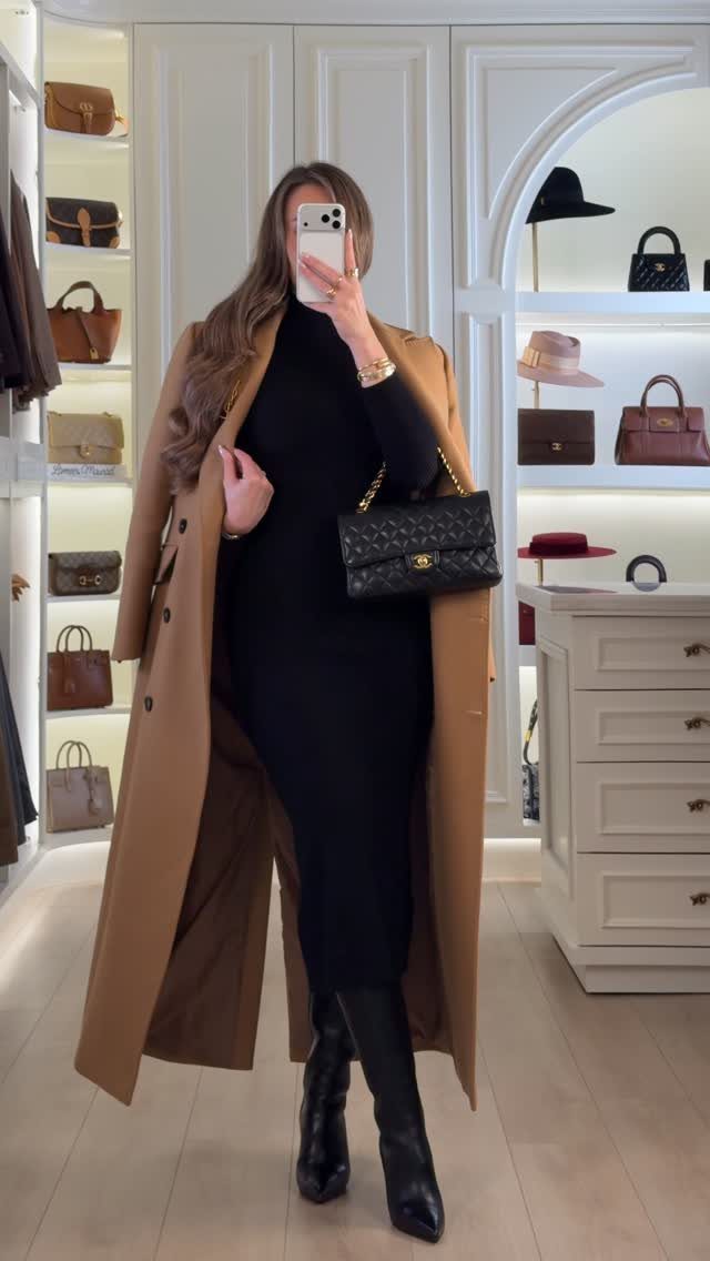 9 Dress and Coat Outfit Ideas for Work, Evenings and More 8 Woman wearing a long black dress and tan coat with black boots and handbag.