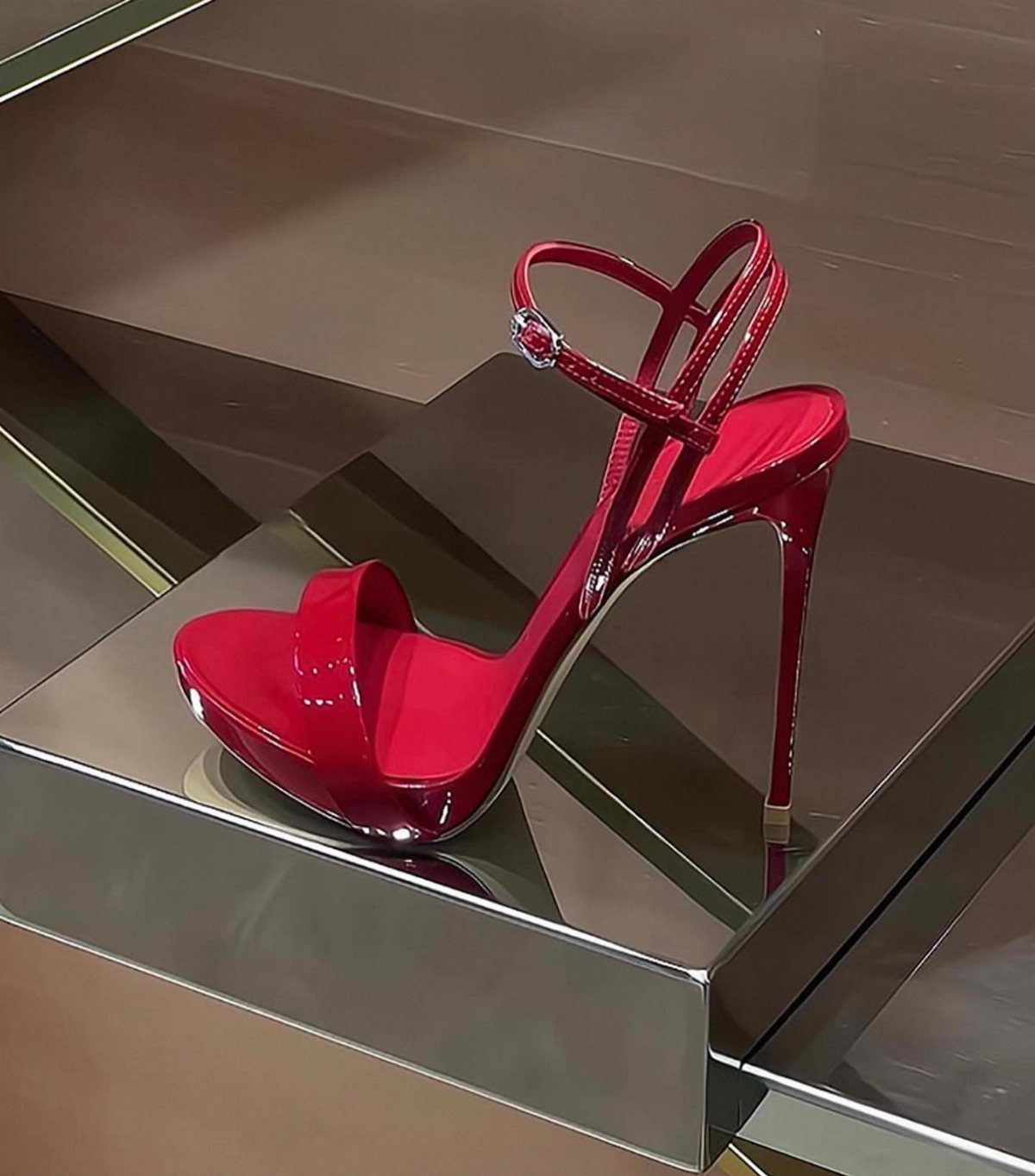 High Heels Design Ideas: 9 Styles from Slingbacks to Platforms 5 Red stiletto sandal with platform sole and ankle straps on mirrored display