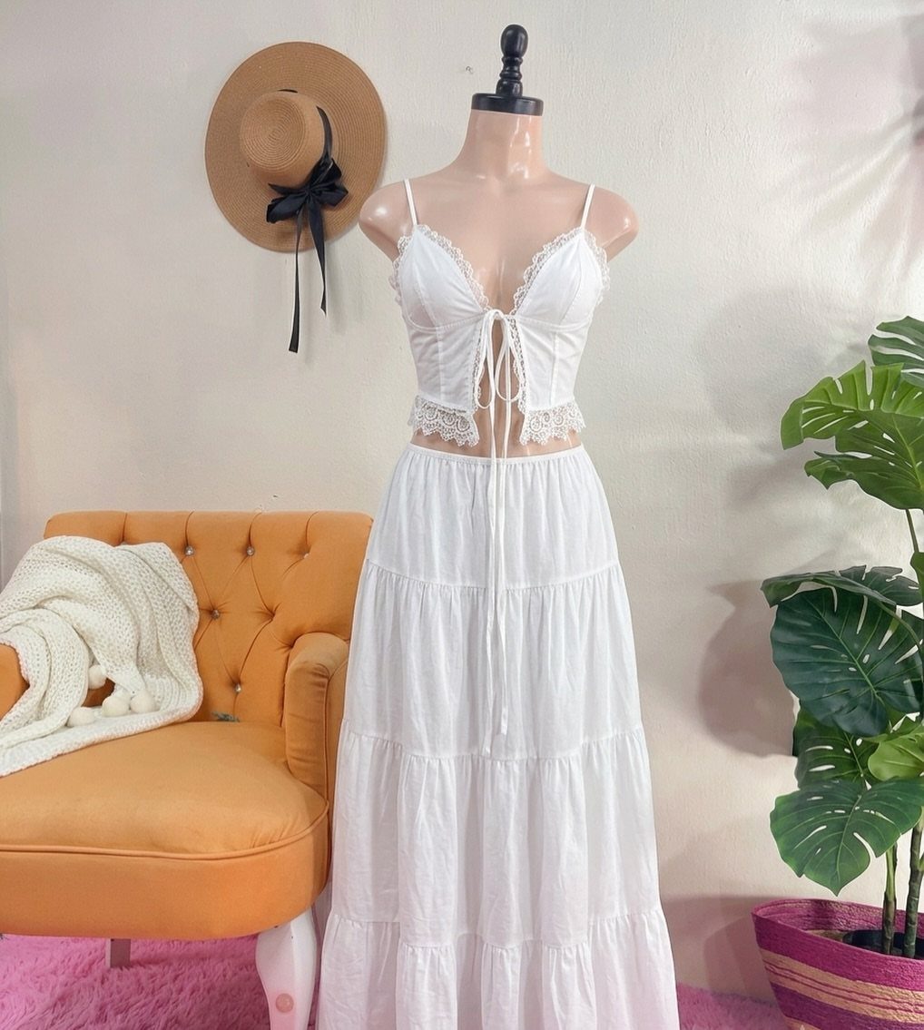 White lace crop top and tiered maxi skirt set displayed on a mannequin.