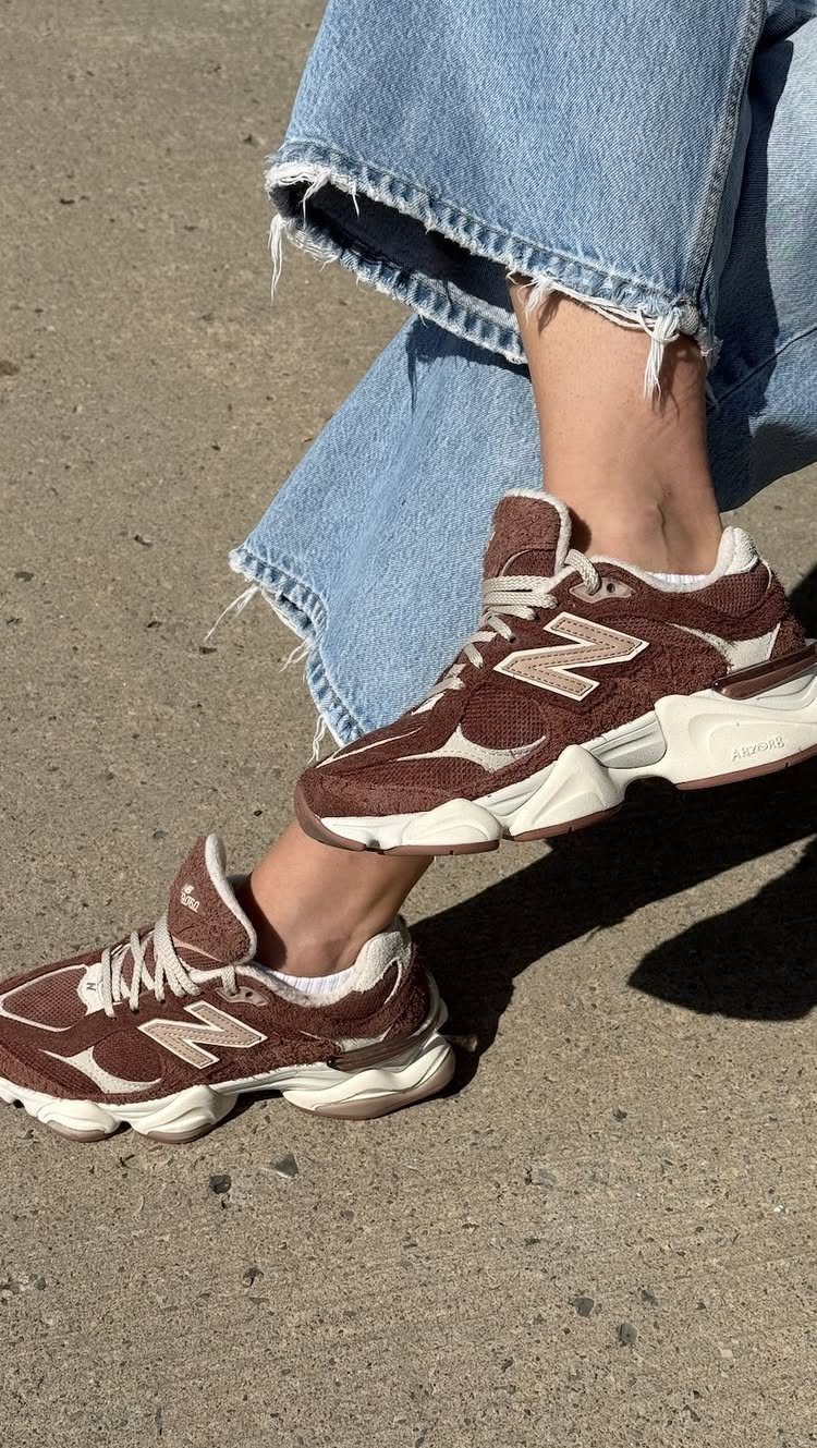 New Balance 9060 All Colors: 8 Pairs to Consider 7 Brown and beige New Balance 9060 sneakers worn with light blue denim jeans.