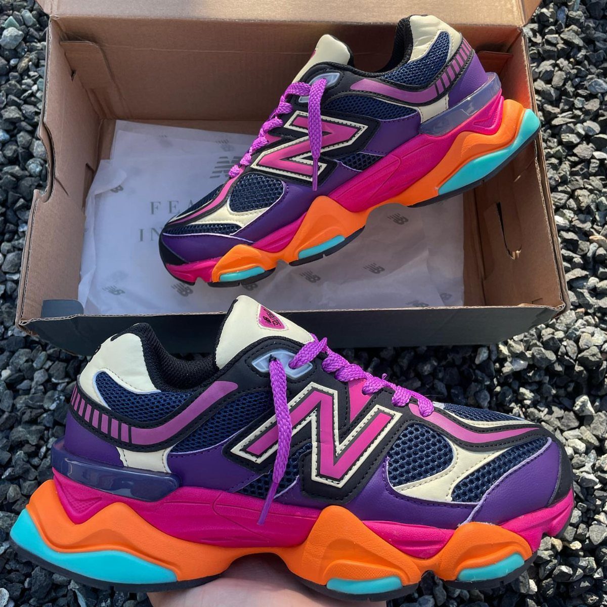 New Balance 9060 All Colors: 8 Pairs to Consider 4 Multicolor pink New Balance 9060 sneakers with purple, orange, and teal accents.