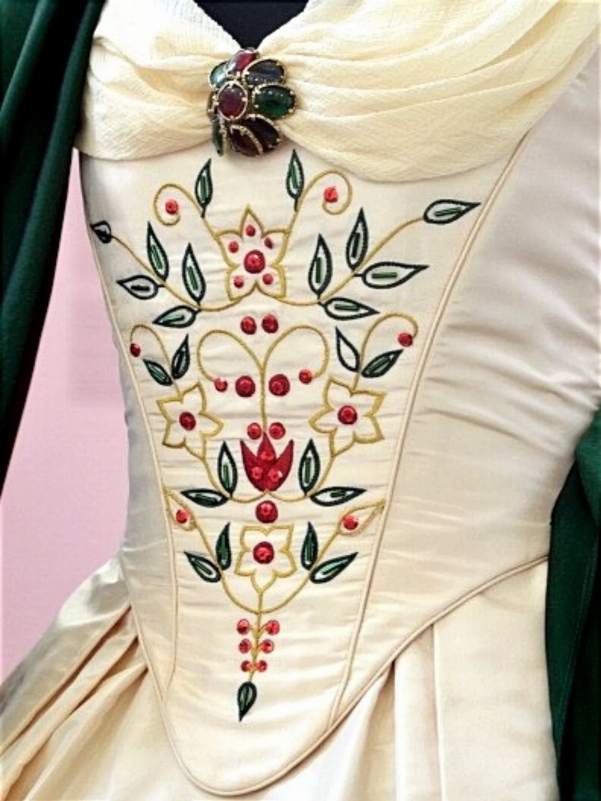 Cream Regency era ball gown bodice with gold embroidery and red gemstone accents
