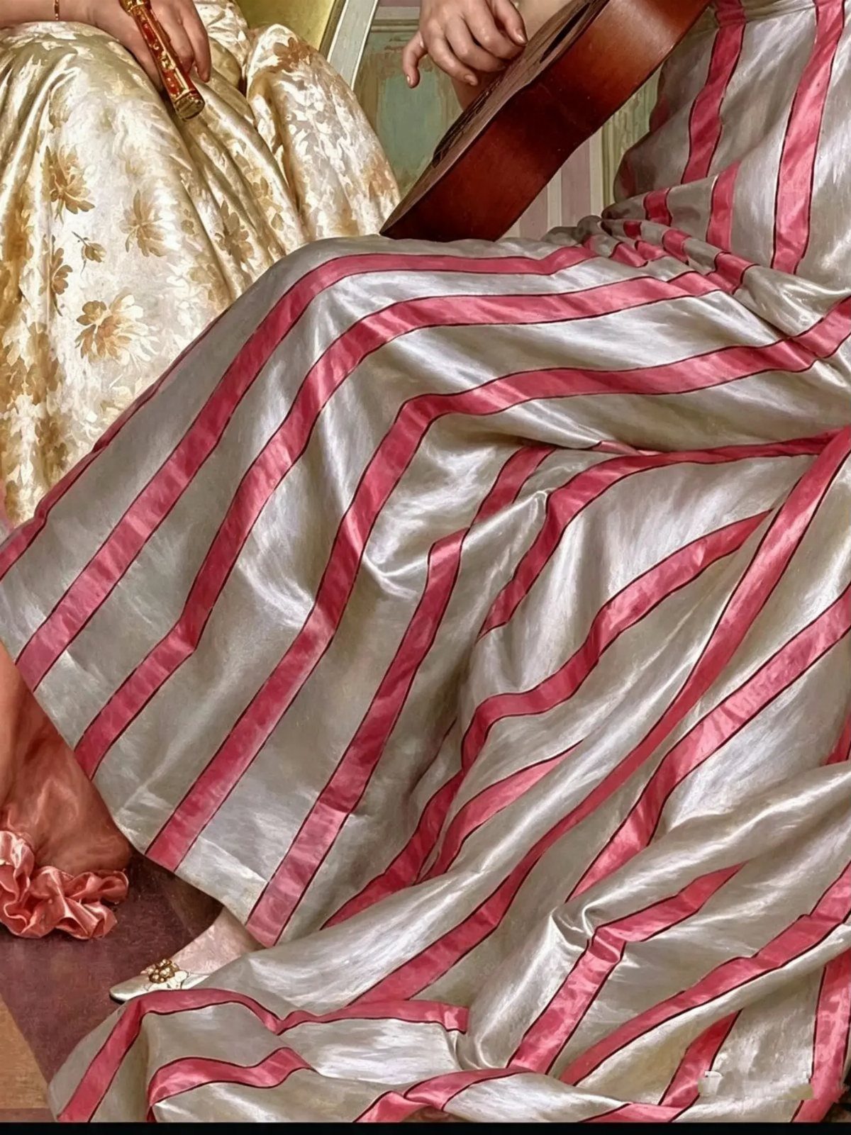 Silver satin gown with pink stripes worn by a person holding a lute.
