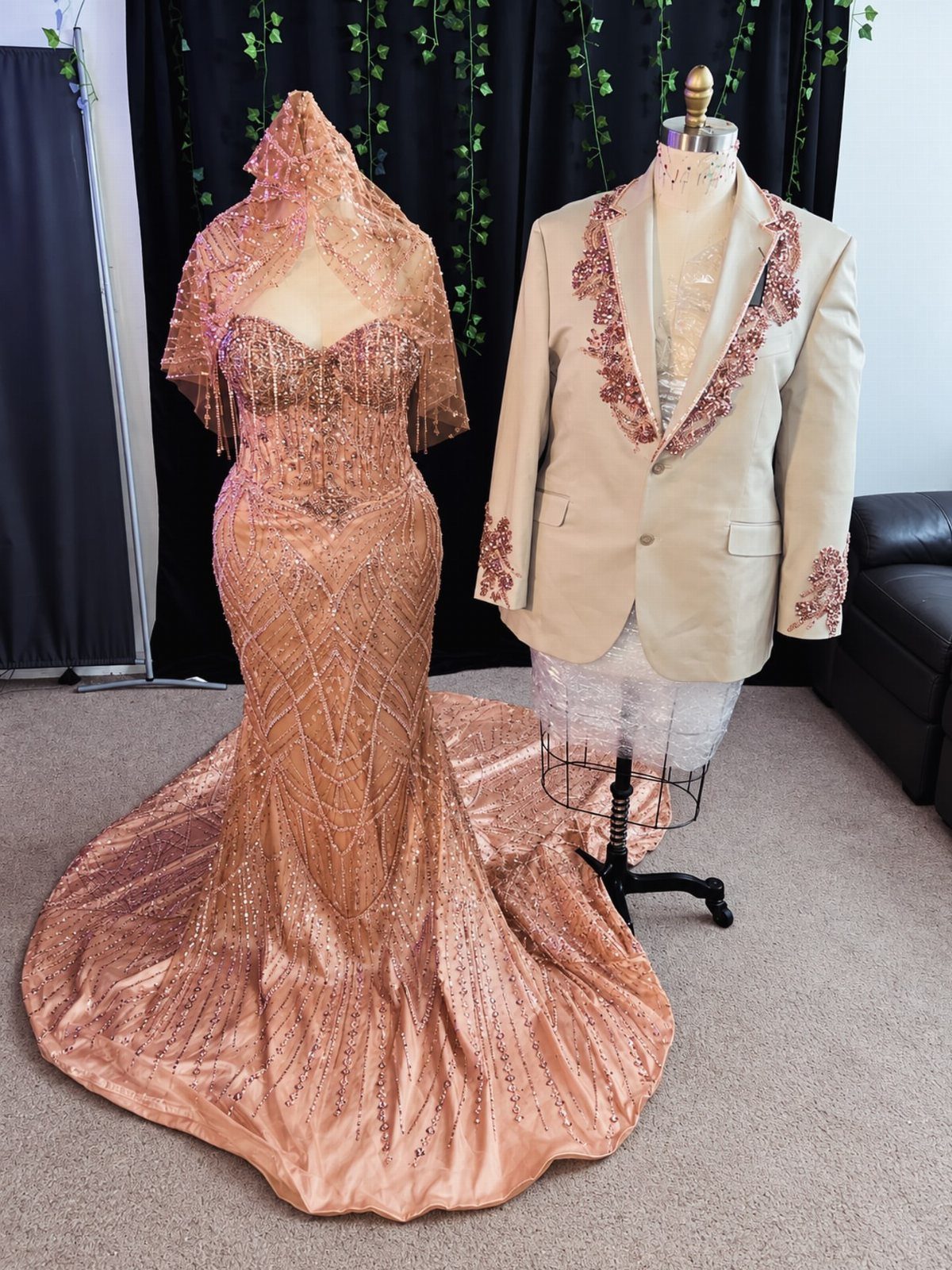 Rose gold sequined prom dress and matching beige tuxedo jacket on mannequins.
