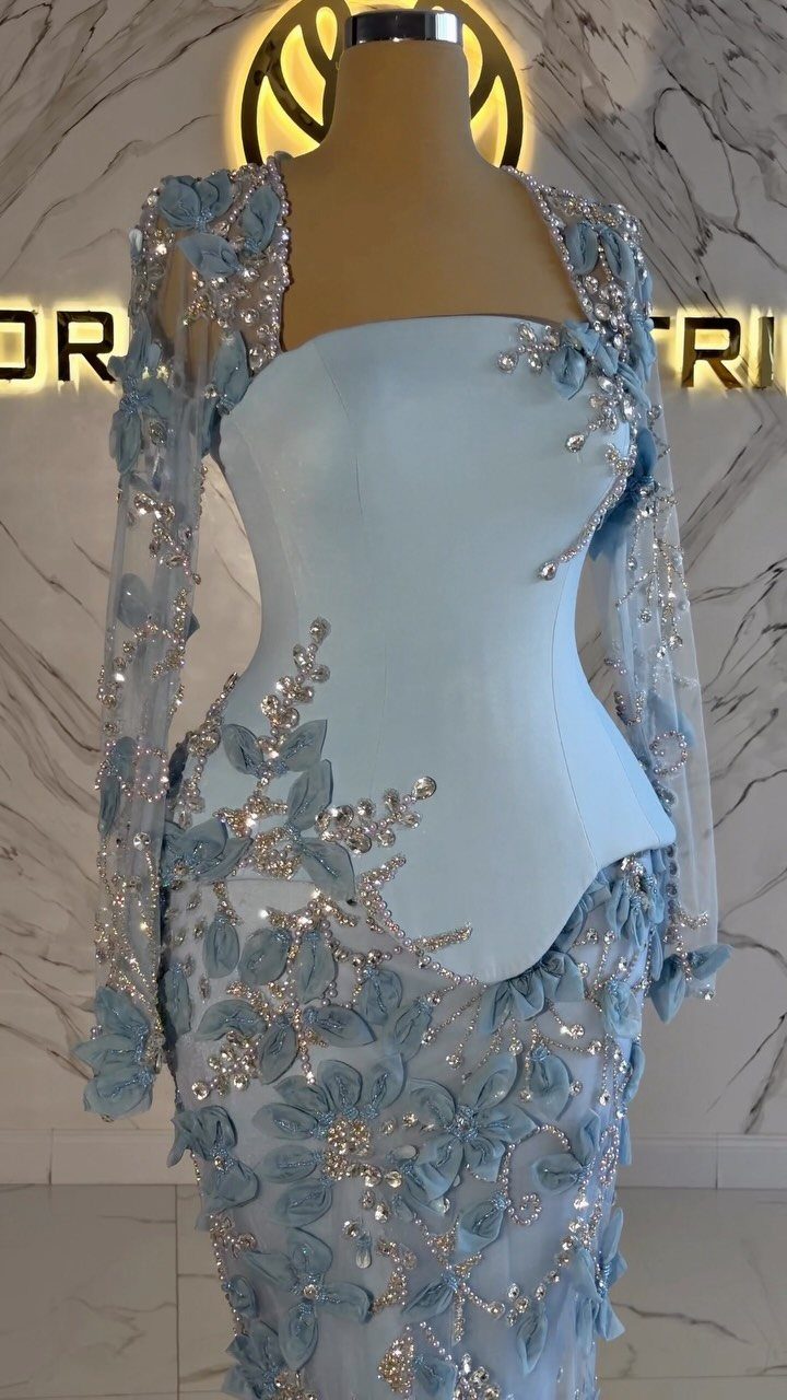 Light blue gown with silver floral sequins and beads on a mannequin.
