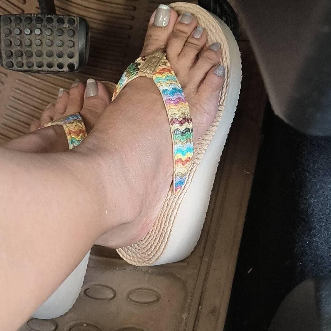 5 Strappy Flip Flops for Women, from Flat to Platform 5 Colorful woven strappy flip flops worn on feet inside a car