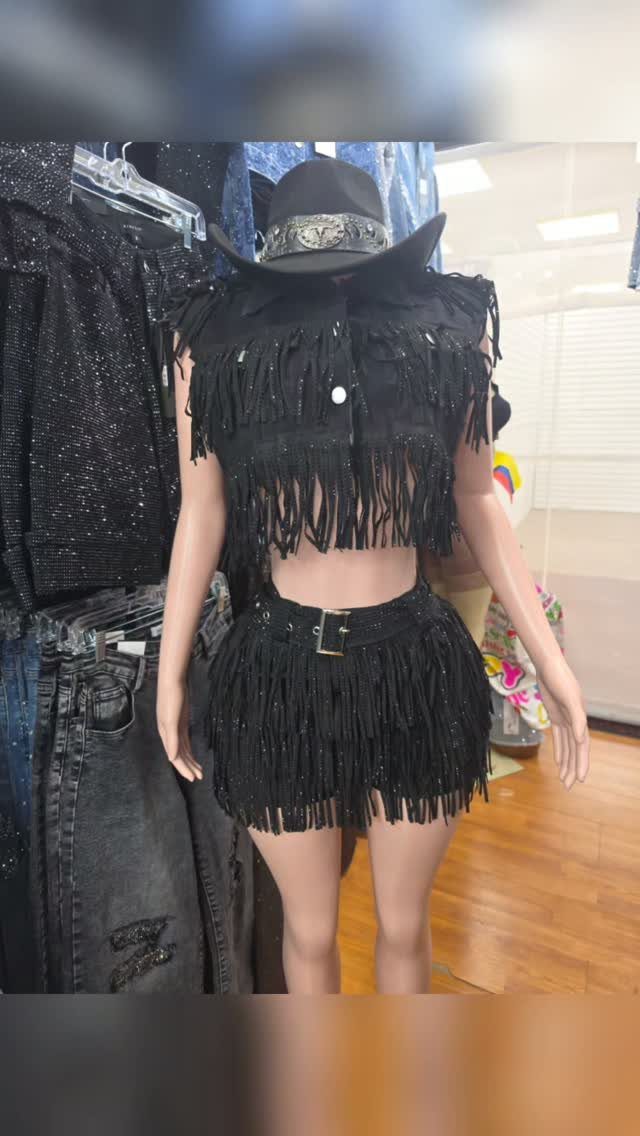 Western Themed Party Outfit Ideas: 8 Looks to Wear 3 Black fringe vest and matching skirt set with a cowboy hat on a mannequin.
